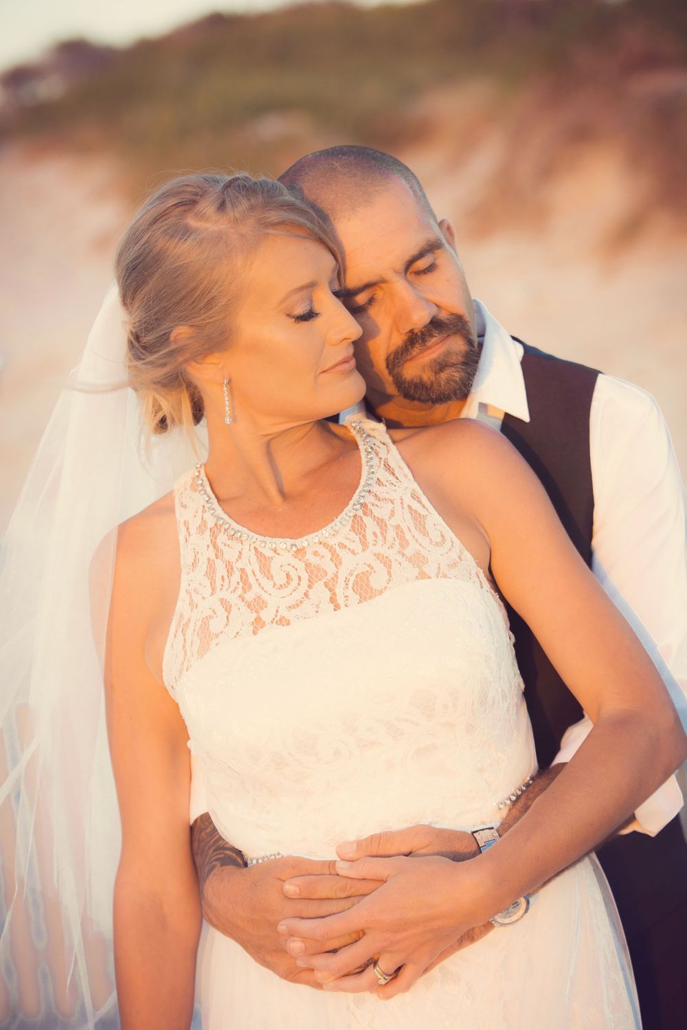 Dreamy wedding portraits show tender embraces between newlyweds in soft focus.