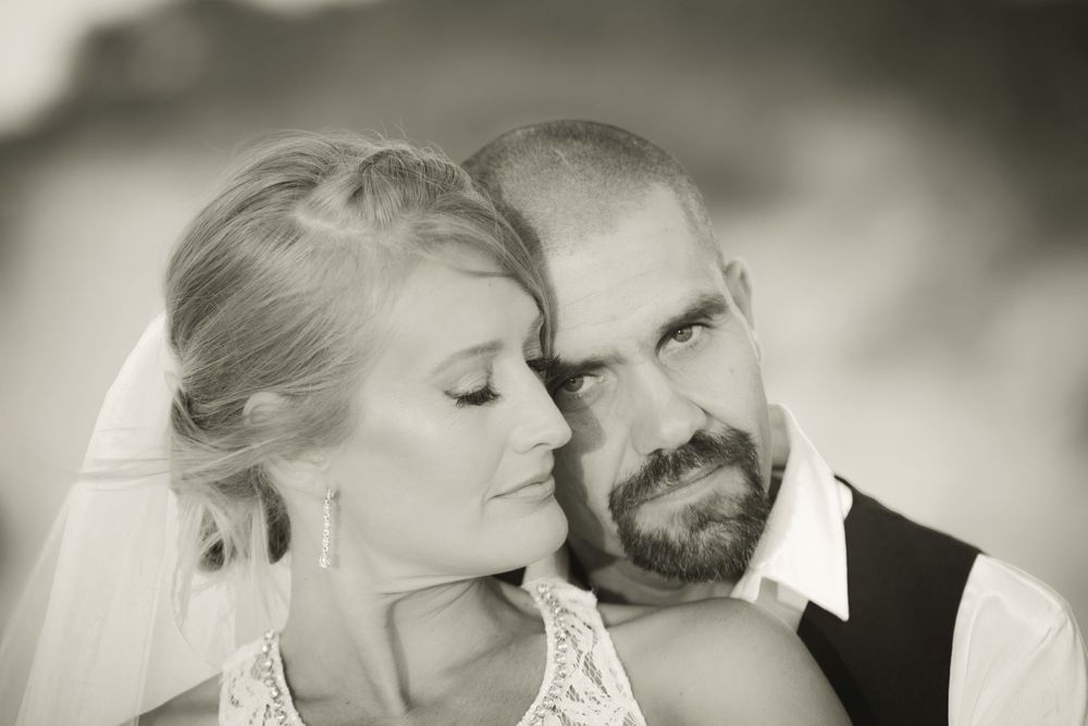 Black and white wedding portraits capture romantic moments between the newlyweds.