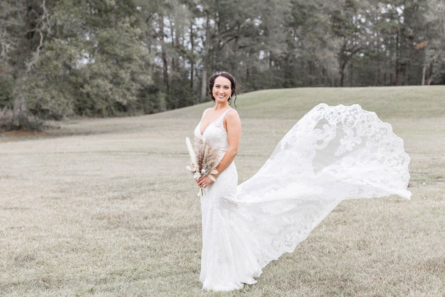 bride with dress blowing in the wind