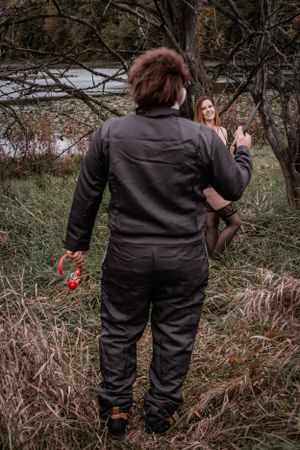 Behind-the-scenes photo of photographer shooting in natural outdoor setting.