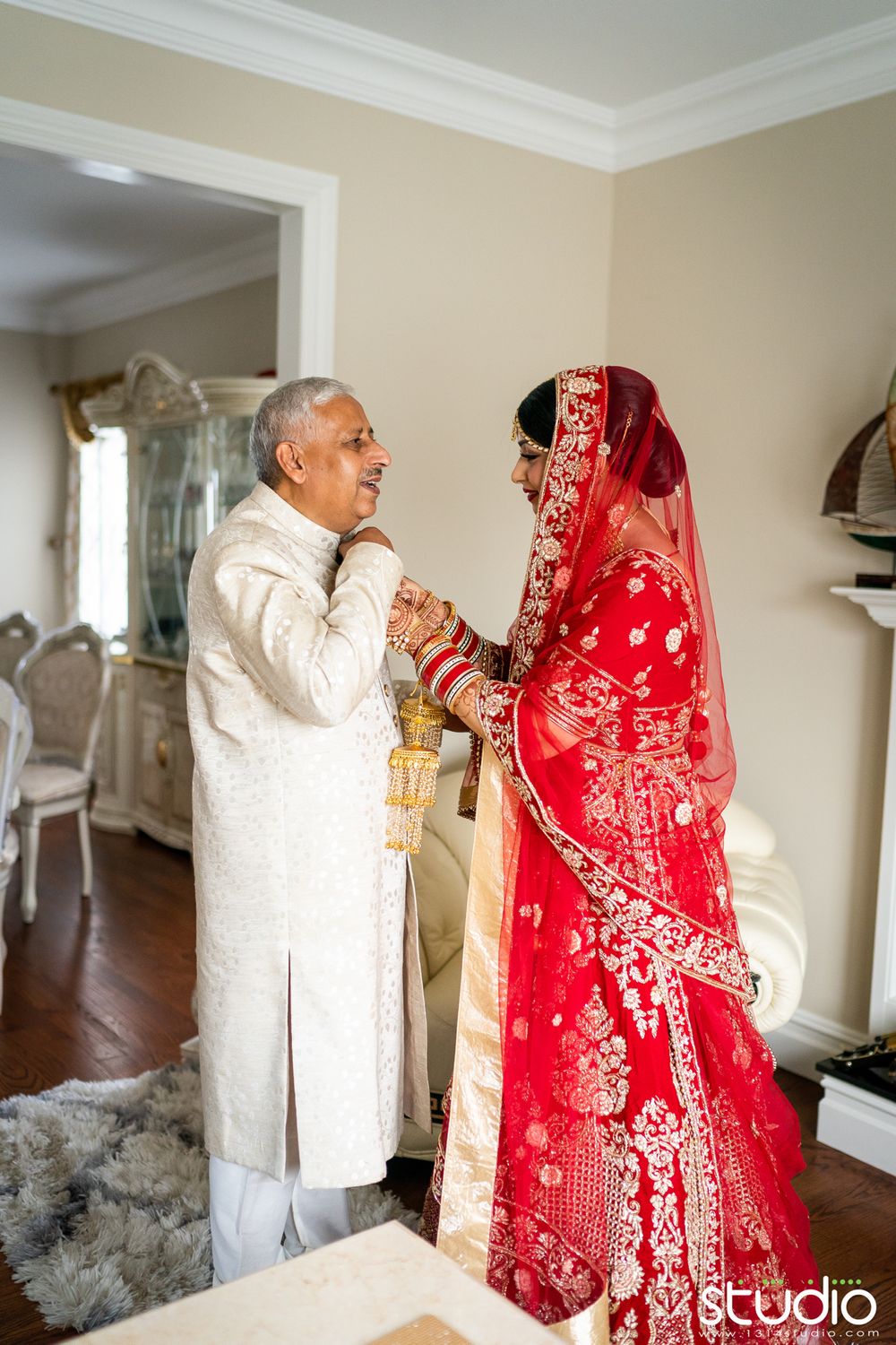 indian bride helping father get ready