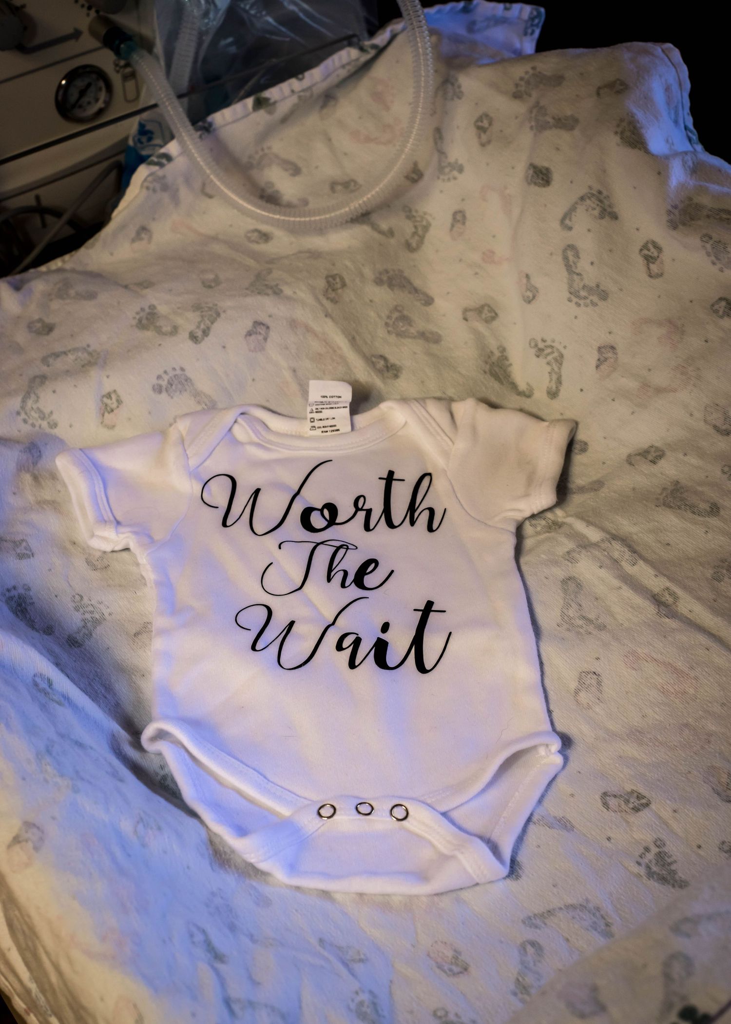 Baby's onesie that says "worth the wait" on the warm at Unity Point Health in Sioux City, IA.