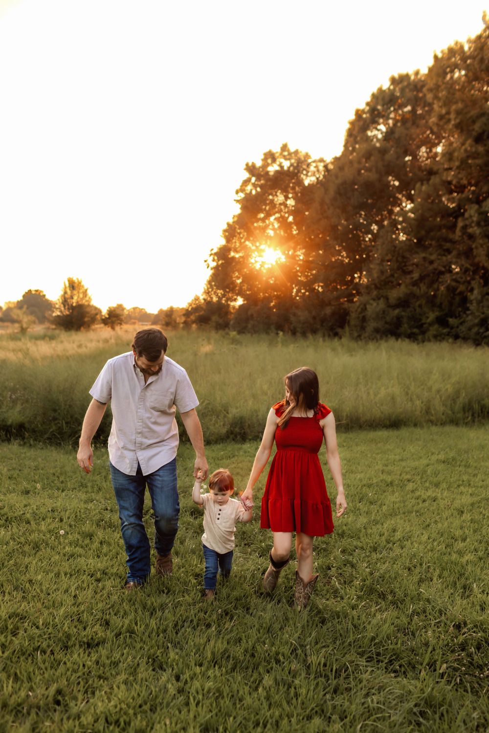 Parents and children laughing together during fall family photos in Hickory NC