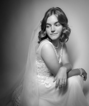 Ethereal bridal portraits highlighting the elegant details of a white wedding gown.
