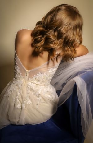 Artistic wedding dress series showcasing delicate lace details and flowing veil.