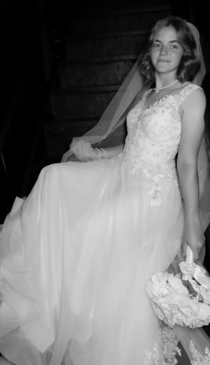 Black and white series showing the dramatic movement of a full wedding gown.