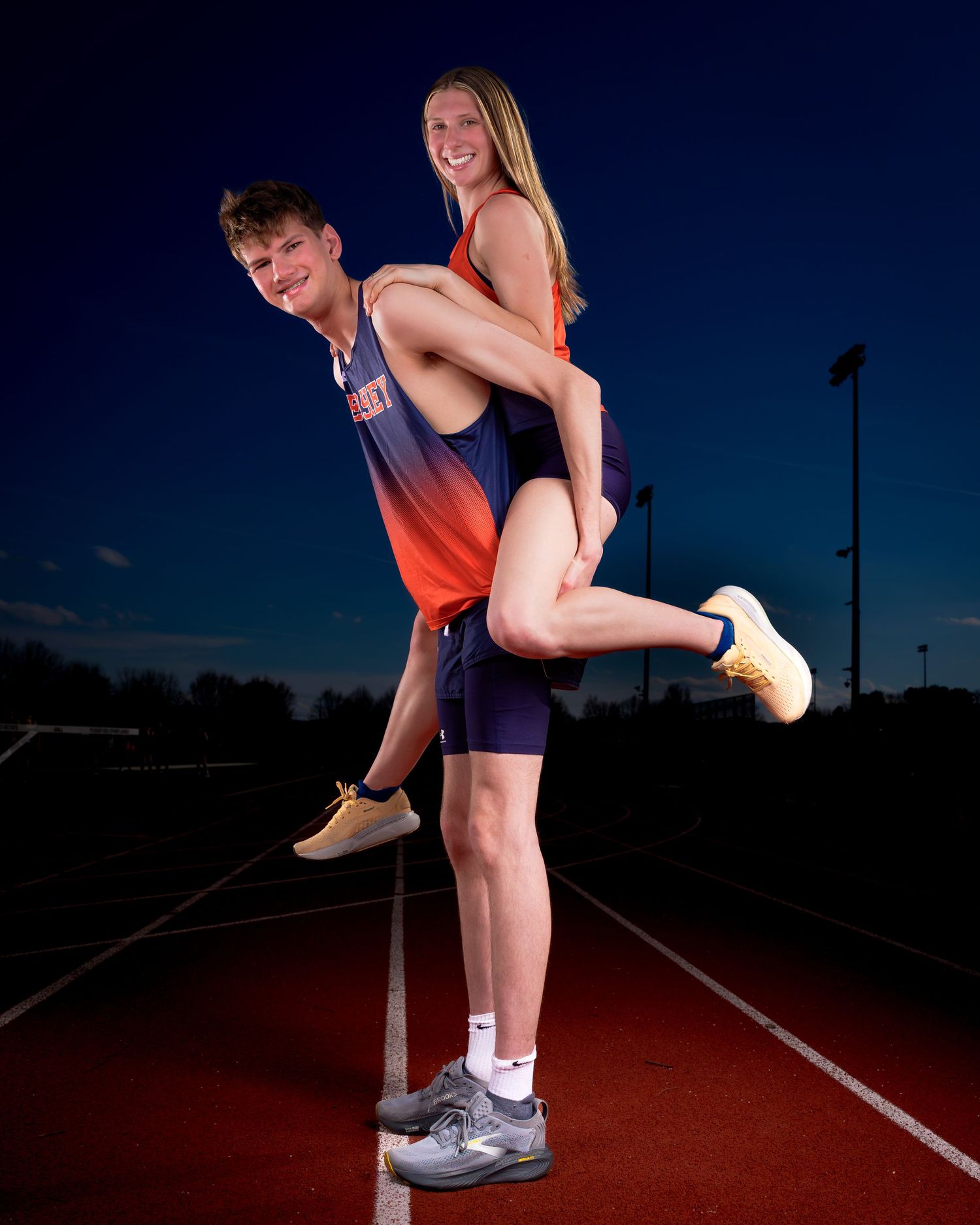 Hershey Trojans track & field athlete high jump action, by Deanna Fox, SportsFox Photography, Hershey PA