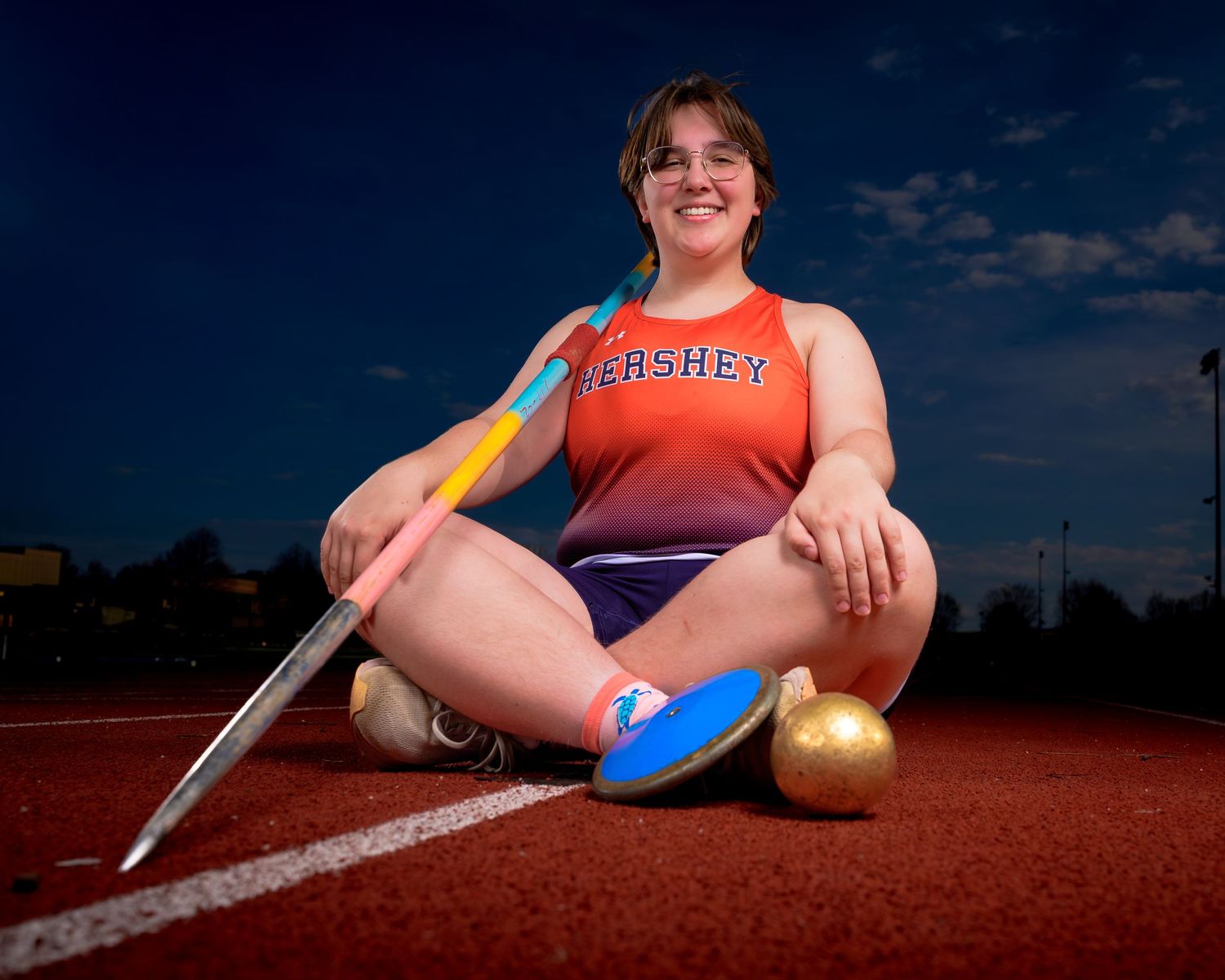 Hershey Trojans thrower portrait with javelin and shot put on photo day, by Deanna Fox, SportsFox Photography, Hershey PA