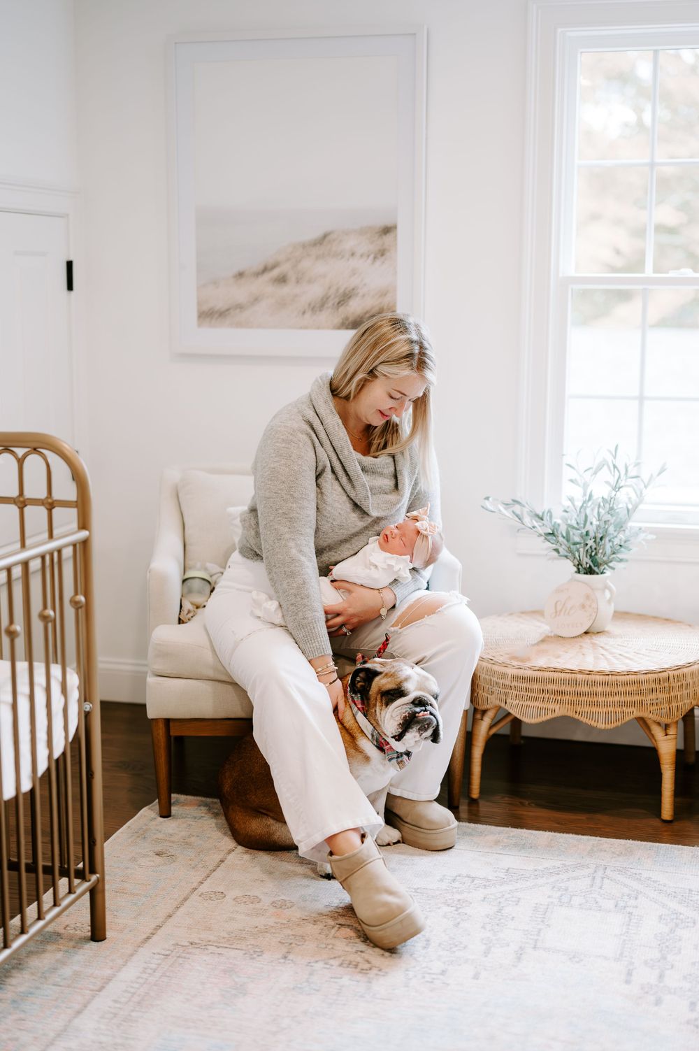 Cozy nursery scene with brass crib and comfortable seating area.