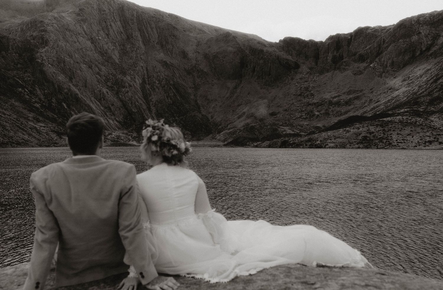 wedding couple looking over lake