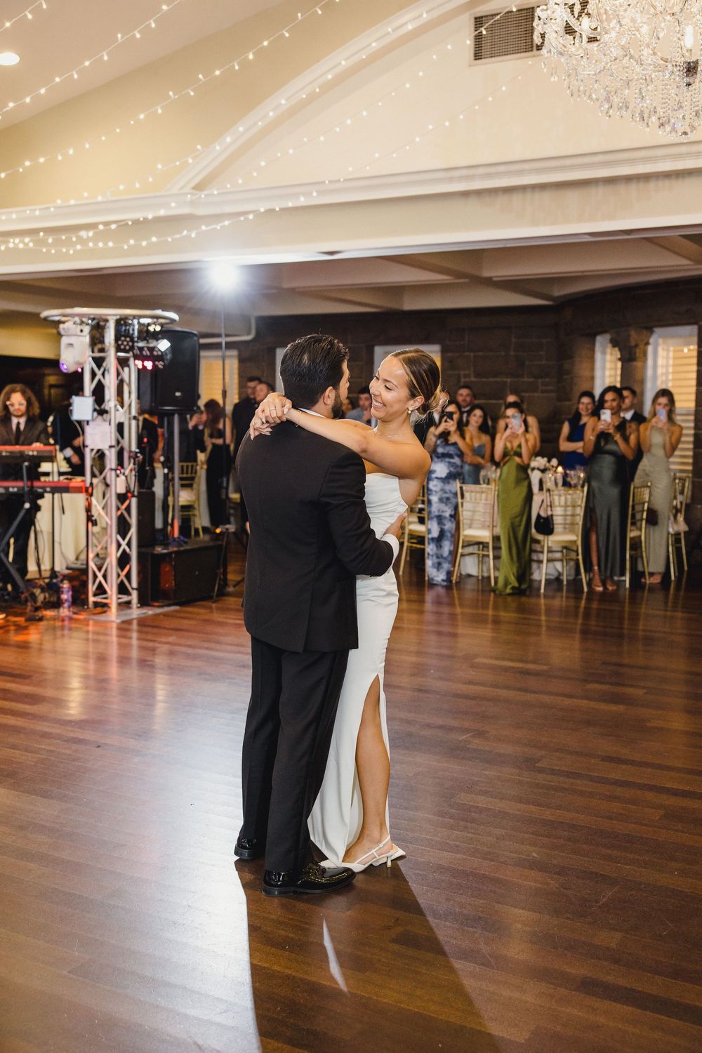 Bride and groom share their first dance OceanCliff Hotel in Newport, Rhode Island.