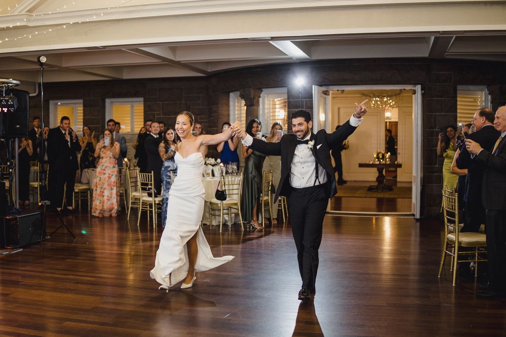 Bride and groom make grand entrance at wedding OceanCliff Hotel in Newport, Rhode Island.