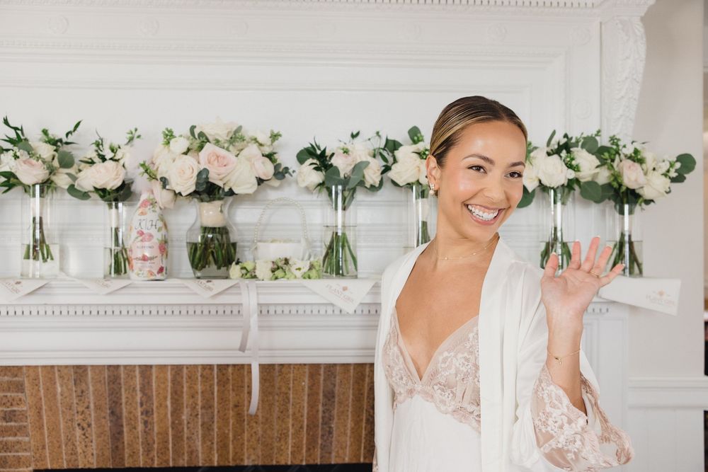 Bride getting ready in the OceanCliff Hotel bridal suite before her Newport RI wedding.