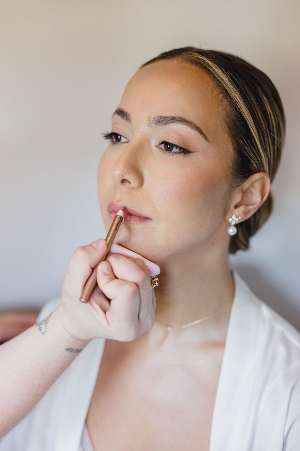 Bride getting ready in the OceanCliff Hotel bridal suite before her Newport RI wedding.