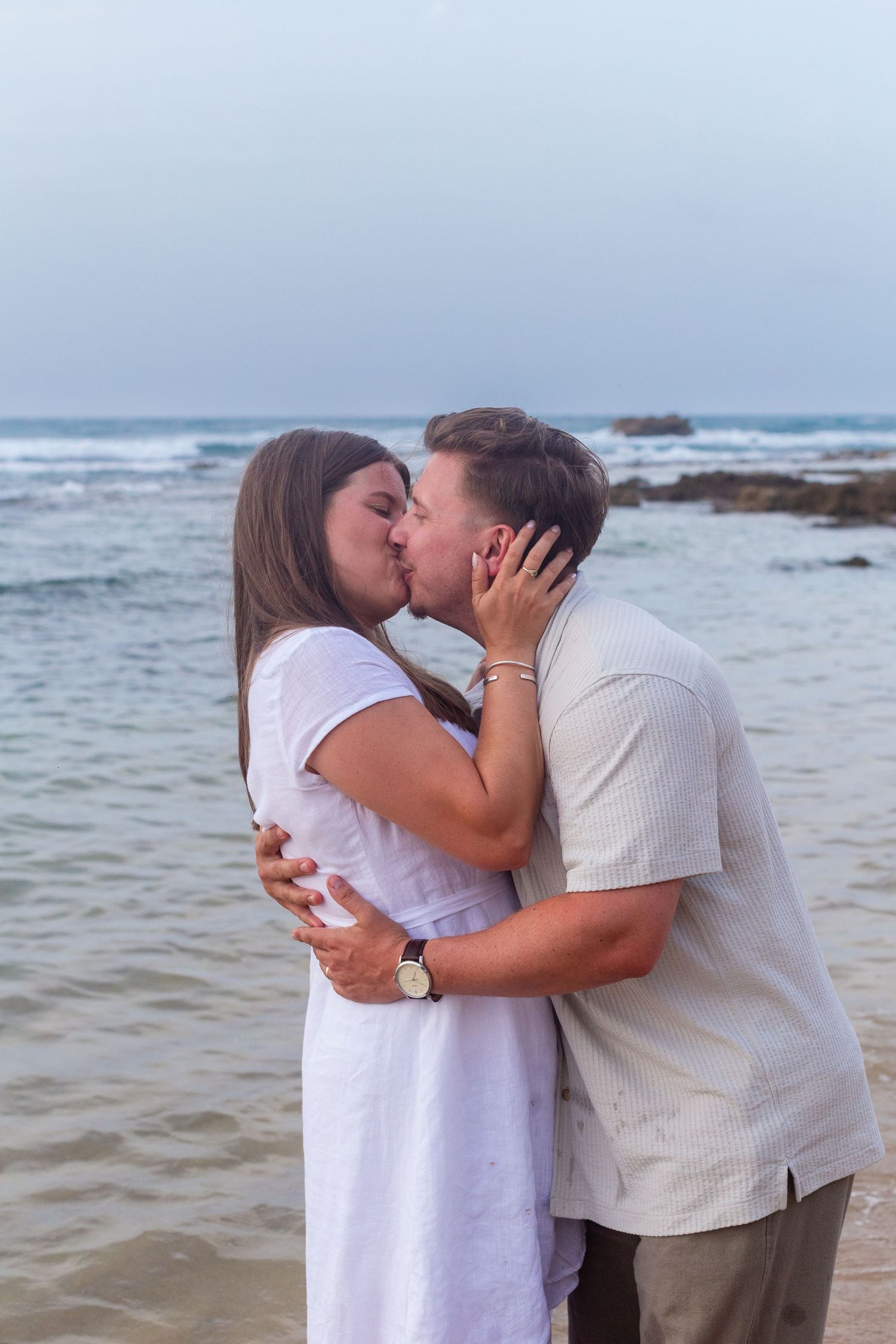Couples portrait on the beach at Balneario del Escambrón in Old San Juan, Puerto Rico.
