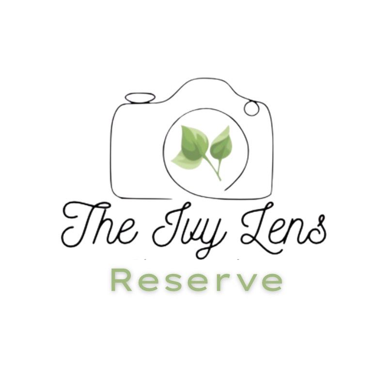 The Ivy Lens Reserve photography logo with camera and green leaves design.