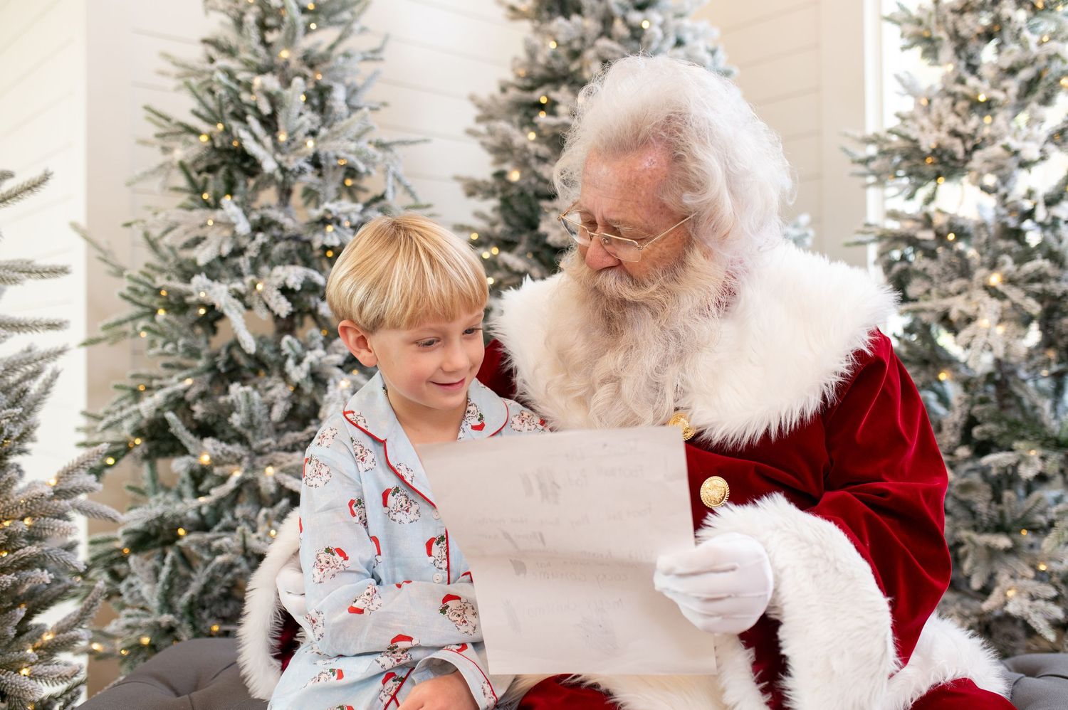 Cozy Christmas scene with decorated tree and fireplace during Santa visit.