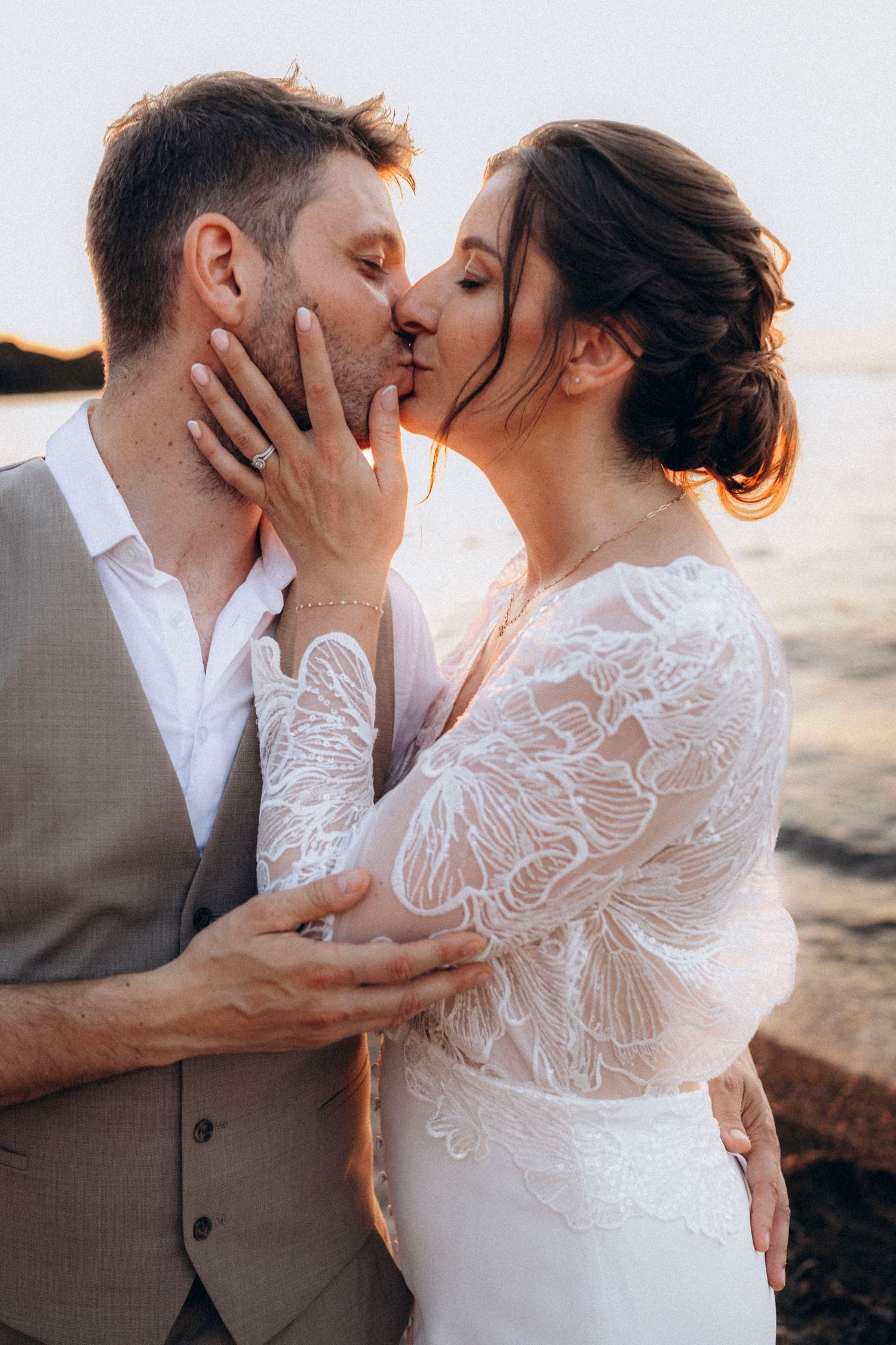 A tender autumn embrace captured during a wedding photoshoot with fall foliage.