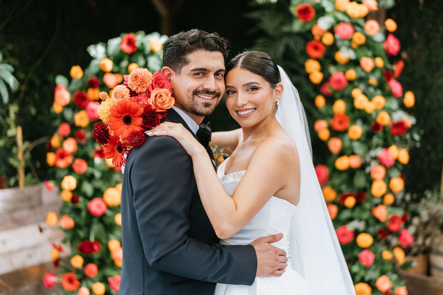 Ruby and Sina smiling together during wedding portraits after their ceremony at Seventh Place.