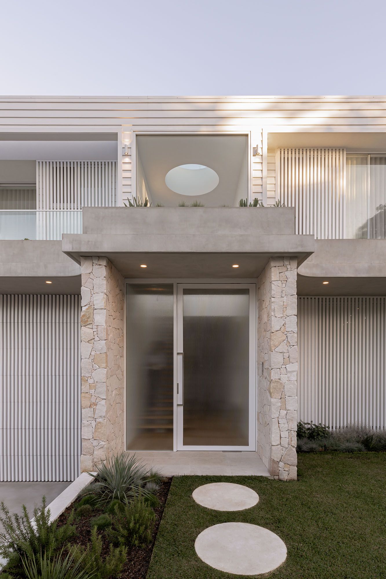 Exterior architectural photography of natural stone entryway and garden path captured in Port Hacking, Sutherland Shire NSW.