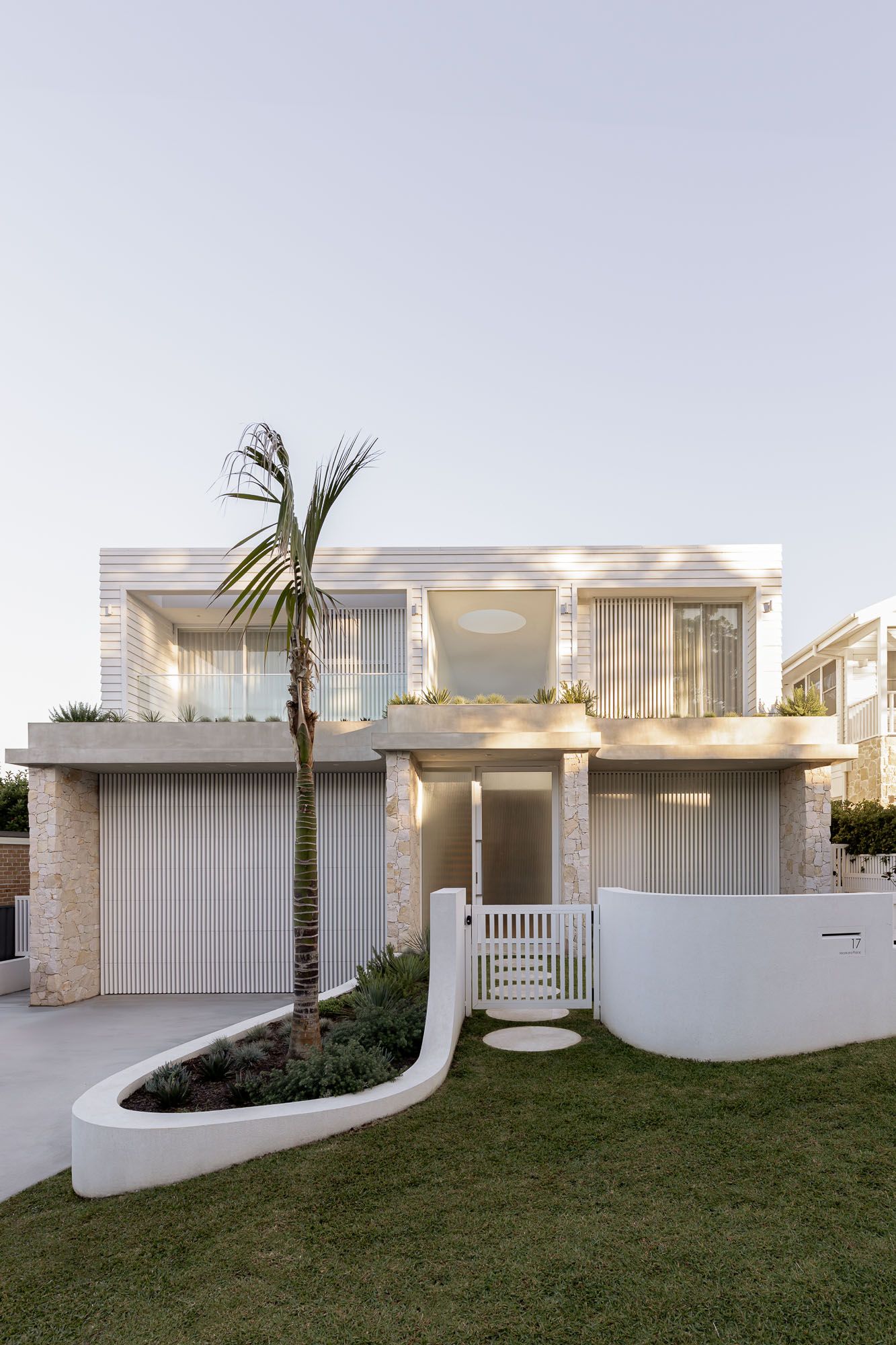 Exterior architectural photography of a home facade with landscaped garden captured in Port Hacking, Sutherland Shire NSW.
