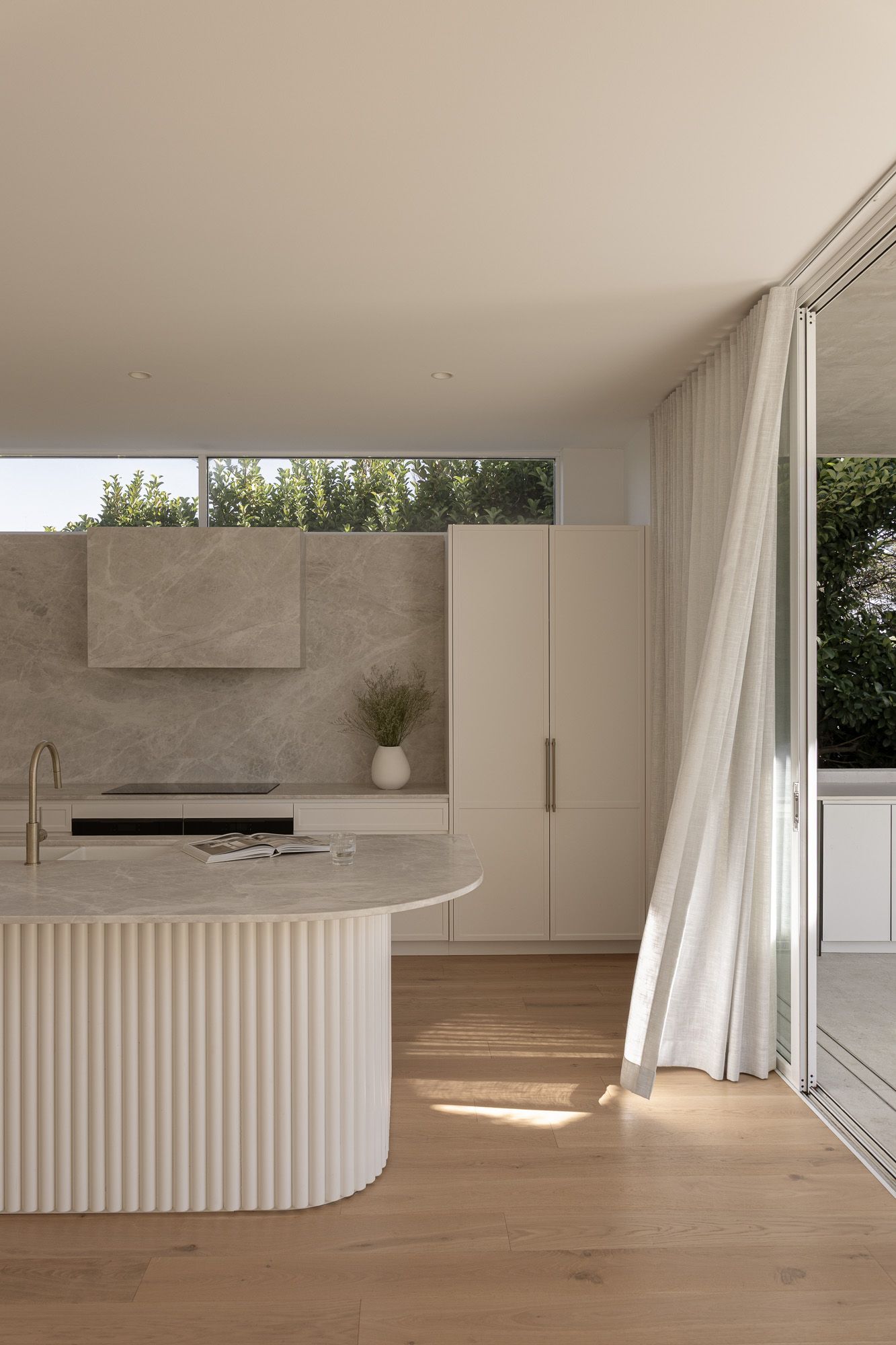 Interior photography of a fluted kitchen island and joinery captured in Port Hacking, Sutherland Shire NSW.
