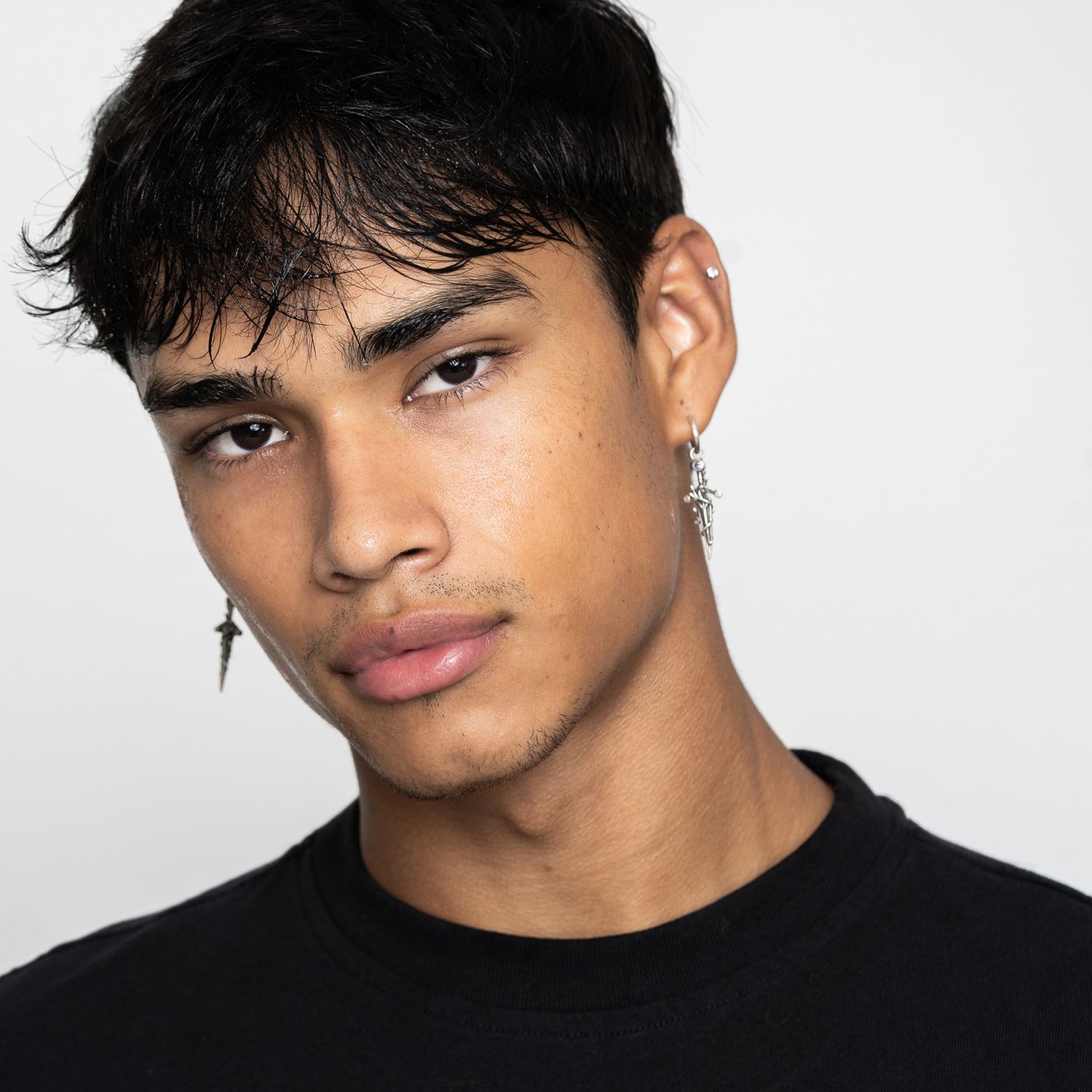 Orlando model headshot photographer Ray Alvarez — male model headshot with clean white background and editorial look