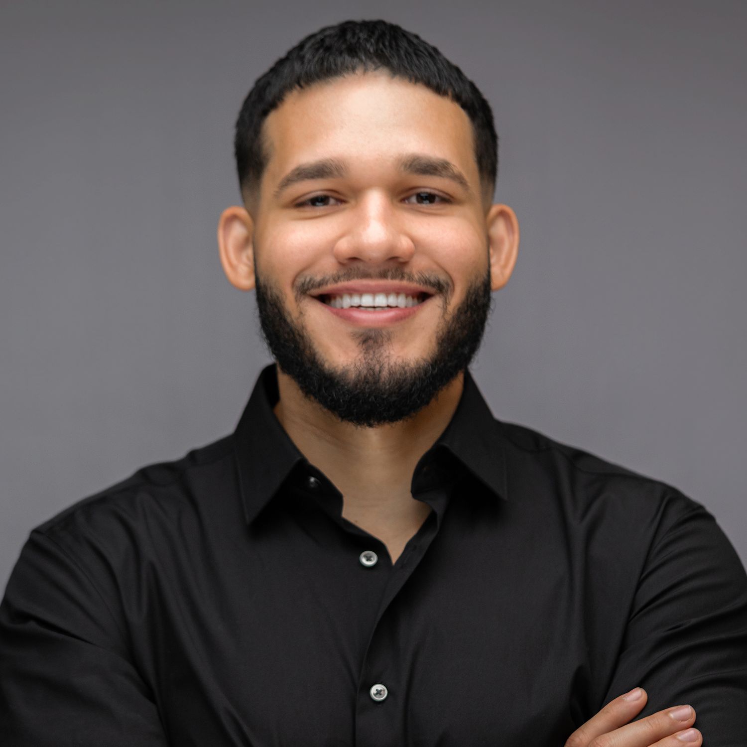 Orlando actor headshot photographer Ray Alvarez — male talent commercial headshot with confident pose and dark shirt