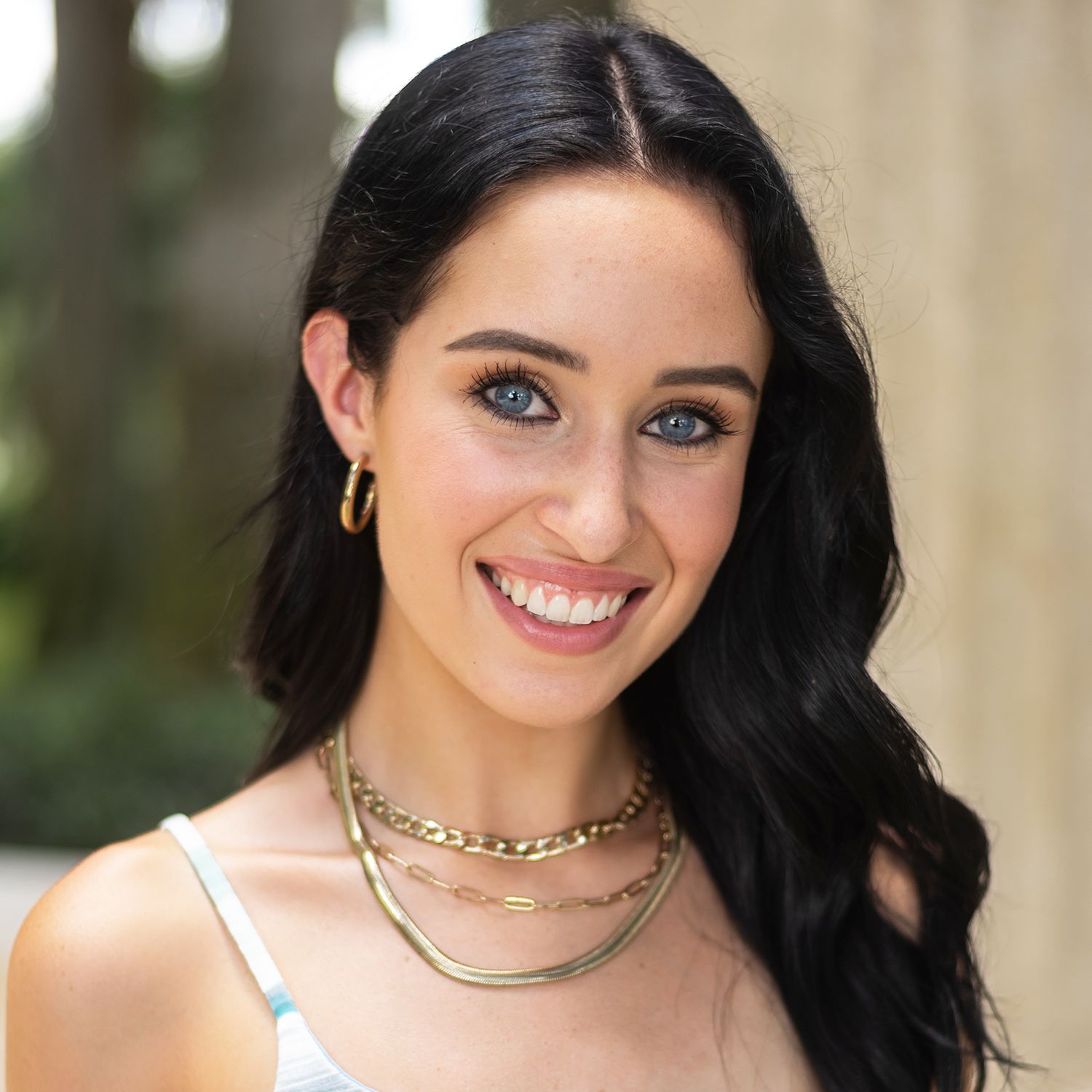 Orlando actress headshot photographer Ray Alvarez — young female actress headshot with natural outdoor setting and elegant styling