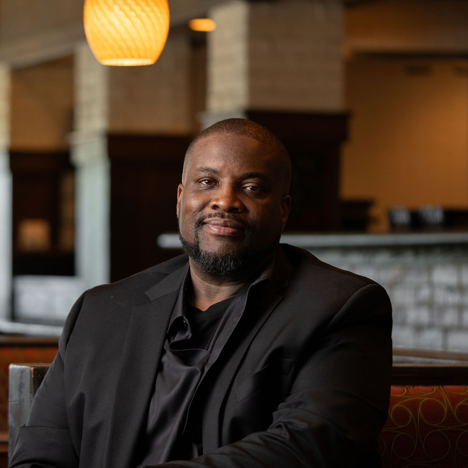 Orlando actor headshot photographer Ray Alvarez — male talent environmental headshot in upscale indoor setting