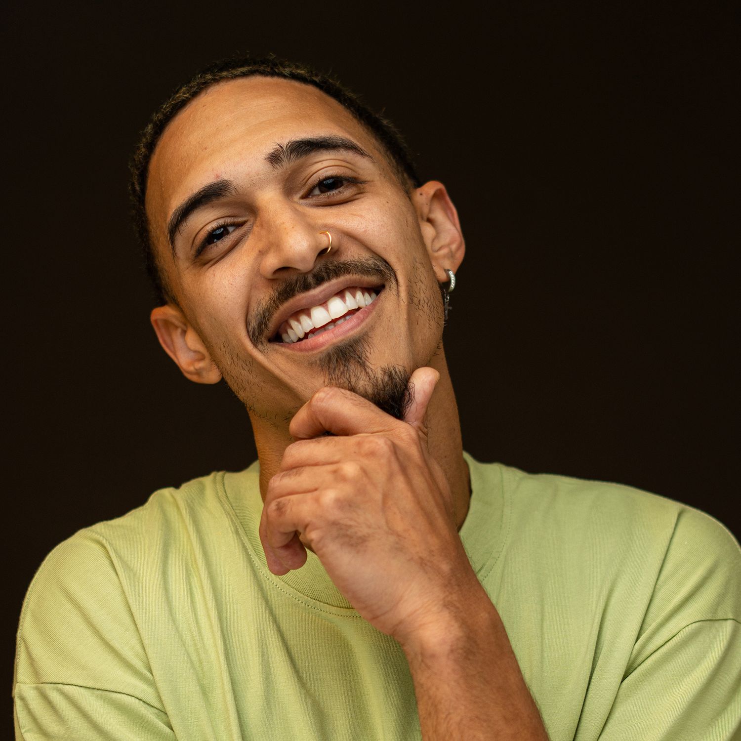 Orlando actor headshot photographer Ray Alvarez — male talent commercial headshot with confident expression and dark background