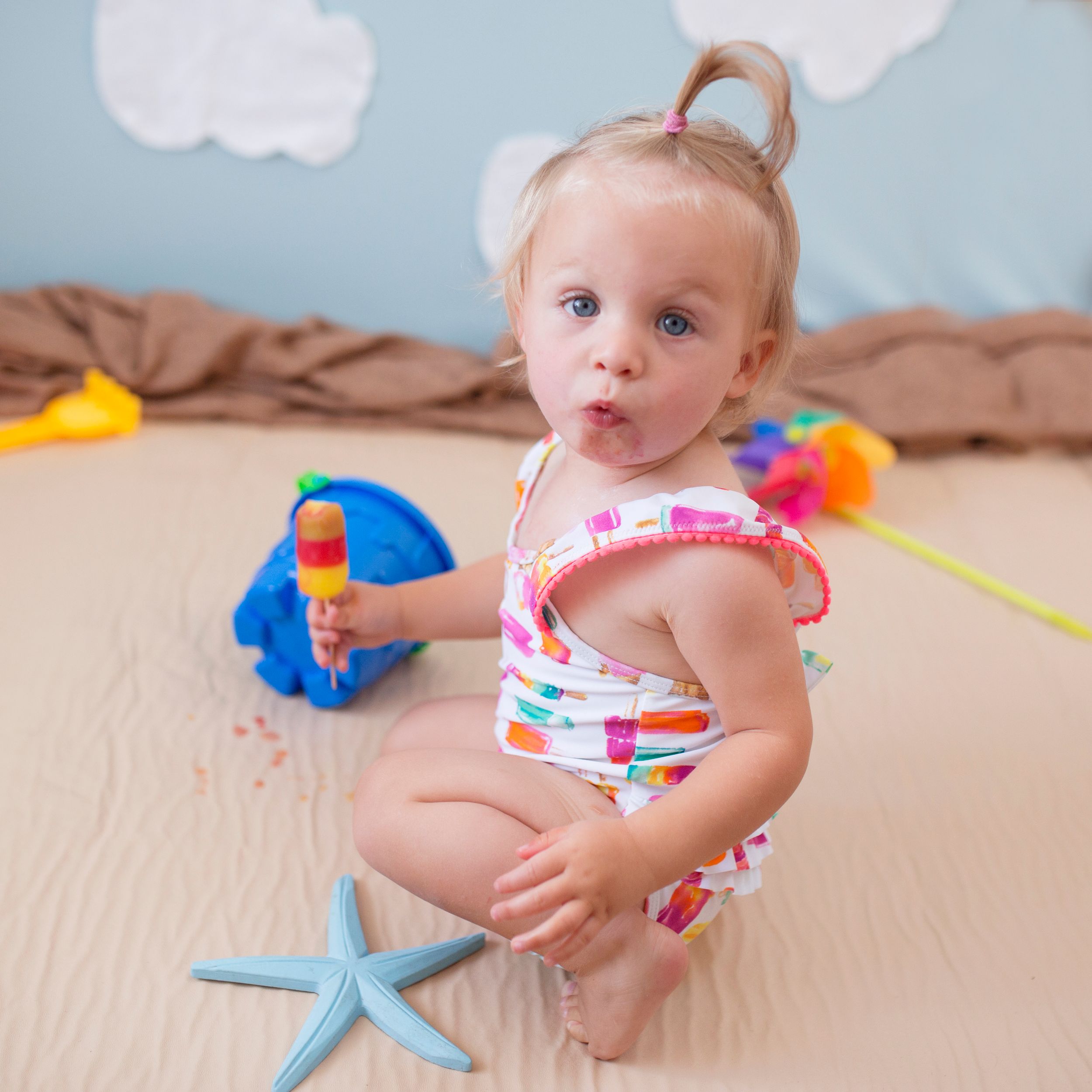 baby enjoying ice cream by little wonderland photography widnes cheshire mini shoot ice cream themed photoshoot beach theme