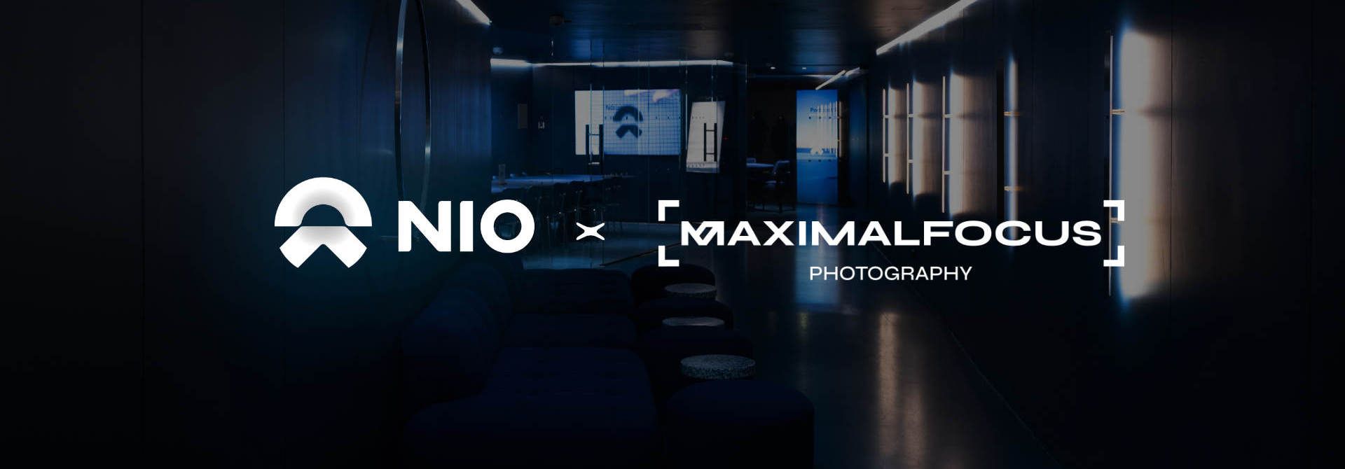NIO x Maximal Focus Photography collaboration logo displayed in a dark, moody corridor setting.