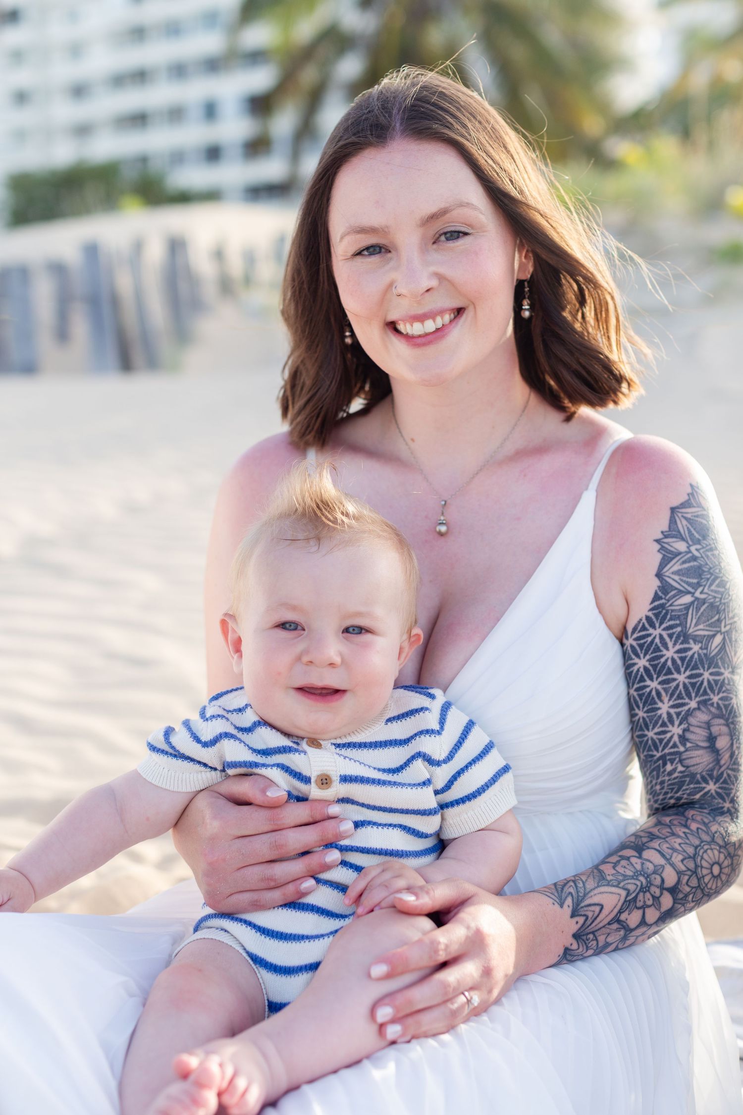 Family portrait on the beach in Isla Verde, Carolina, Puerto Rico. Mother and baby.