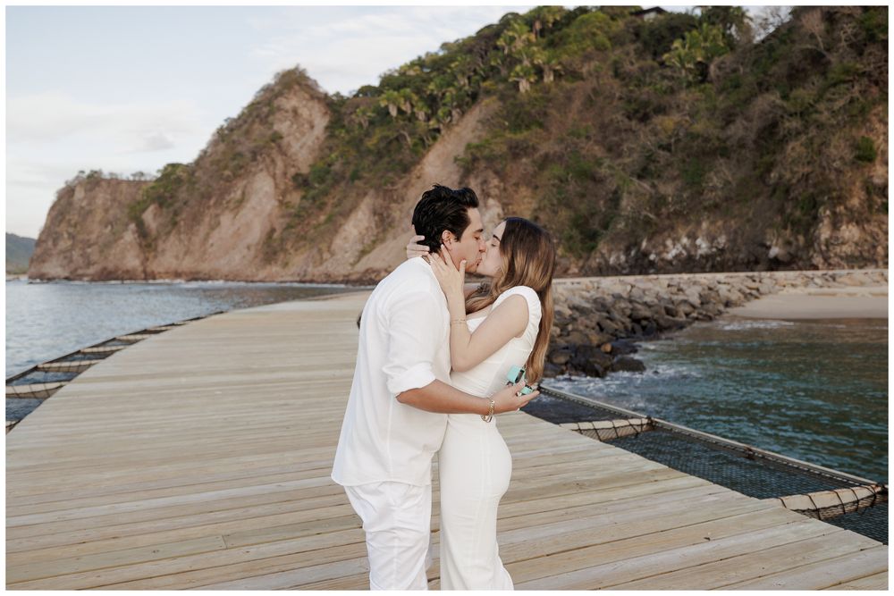 One and Only Mandarina engagement photographer capturing a couple sharing a romantic kiss during a One and Only Mandarina couples session