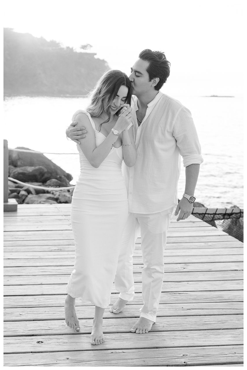 Punta Mita couples photographer capturing a couple on a pier during beach couples photos Mexico.
