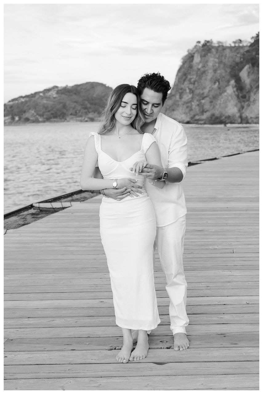 Punta Mita couples photographer capturing a couple embracing on a dock with couples photos Punta Mita.