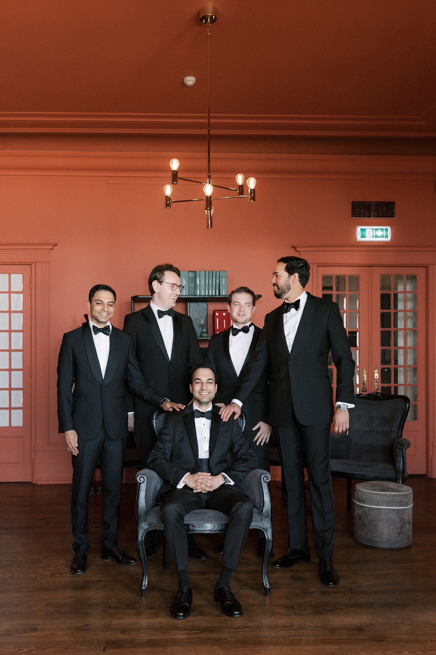 Groom getting ready with his groomsmen before a destination wedding at Arriba by the Sea in Cascais, Portugal.