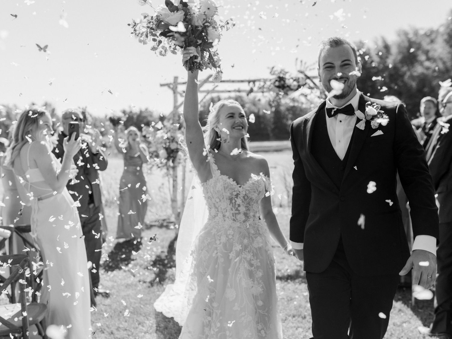 Joyful post-ceremony moment as the couple walks out hand in hand - Intimate Toronto Wedding Photographer, Katie Crane.
