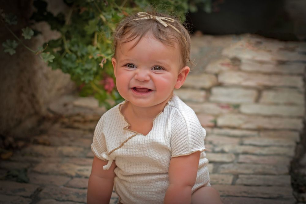 A baby smiling in Yemin Moshe, Jerusalem.