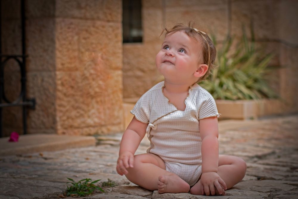 A baby smiling in Yemin Moshe, Jerusalem.