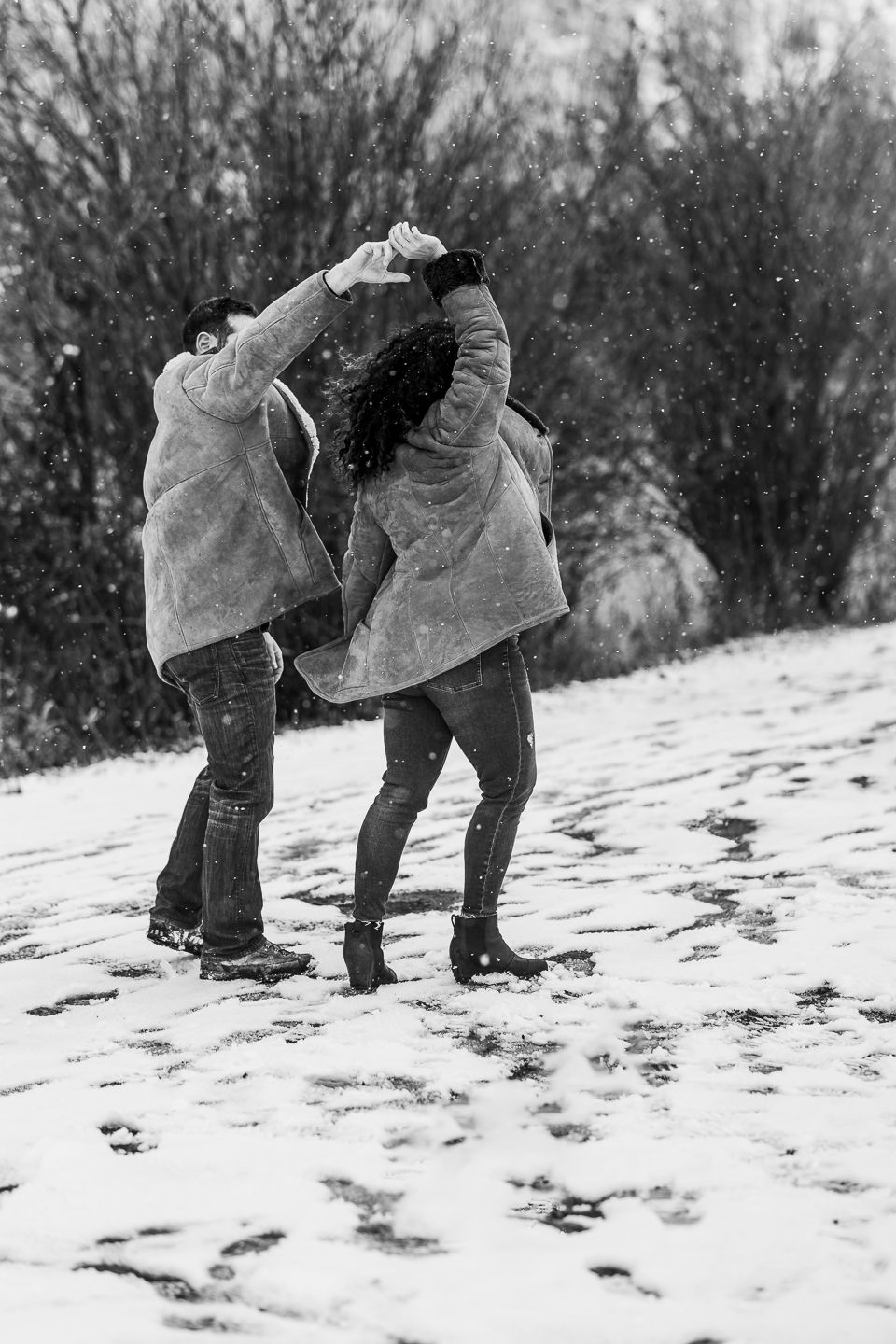 Couple dancing in the snow black and white