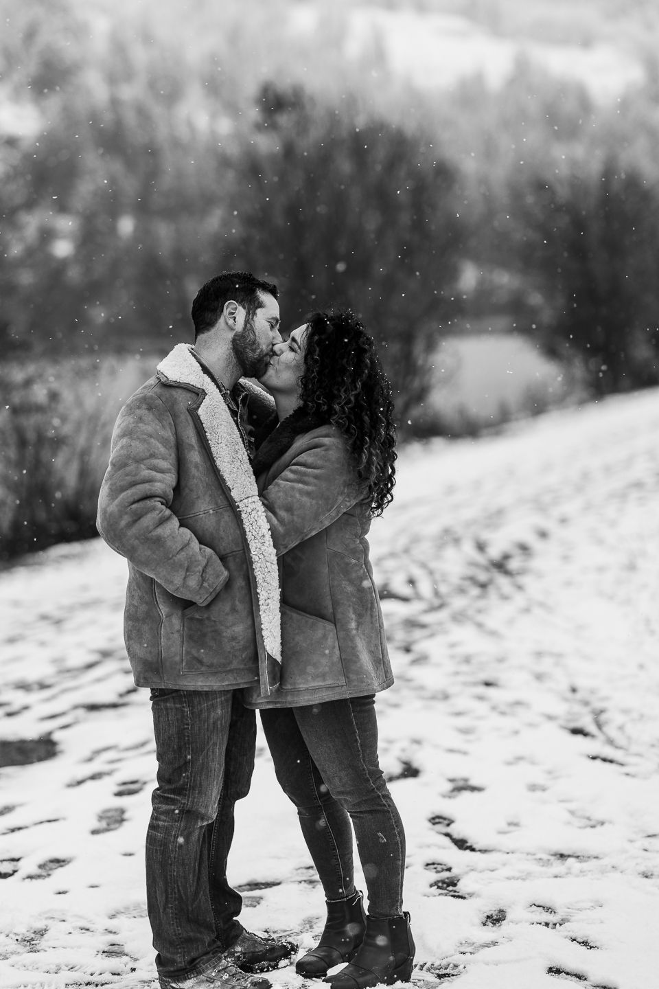 Couple share a wintry kiss