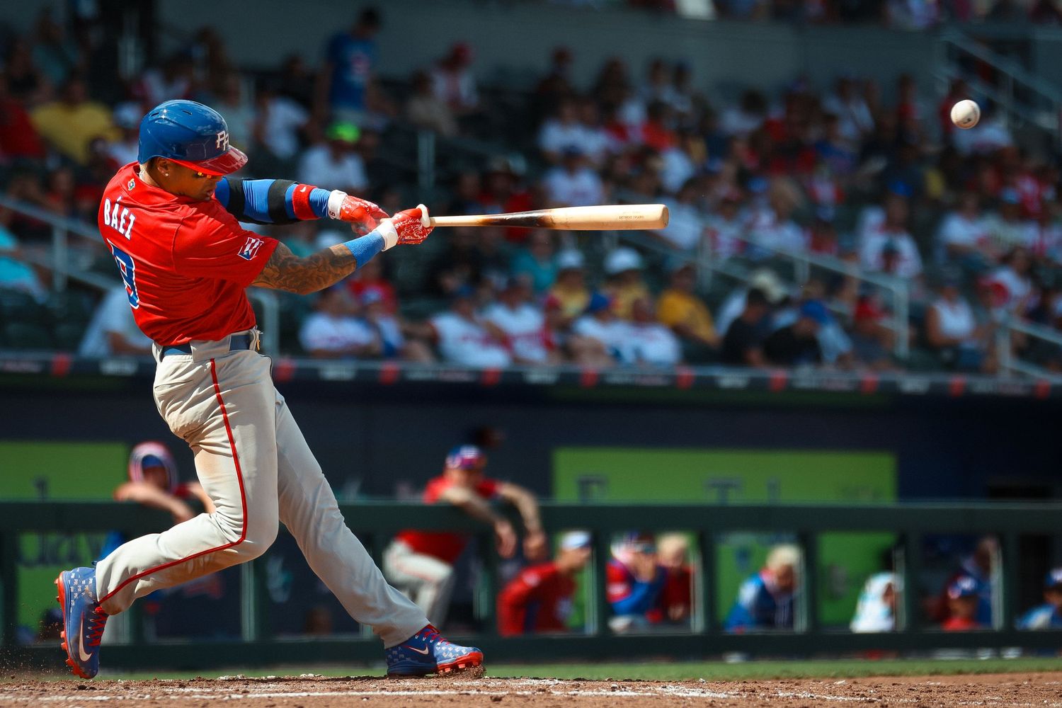 Javier Báez wears the colors of the Puerto Rican national team in exhibition games.