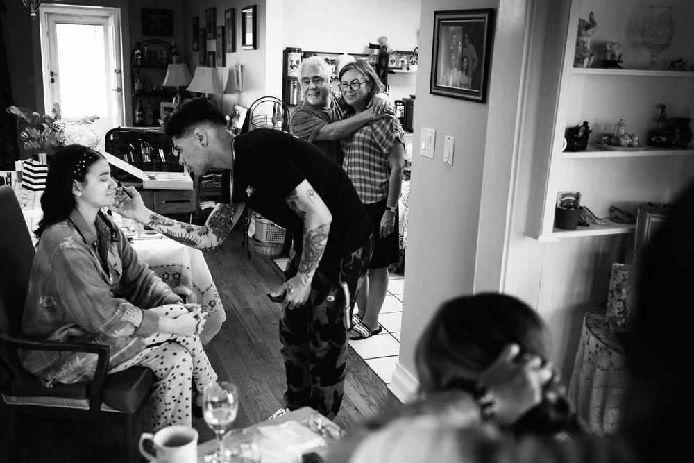 Long Island Bride gets her makeup done in the kitchen of the groom's Long Island home.