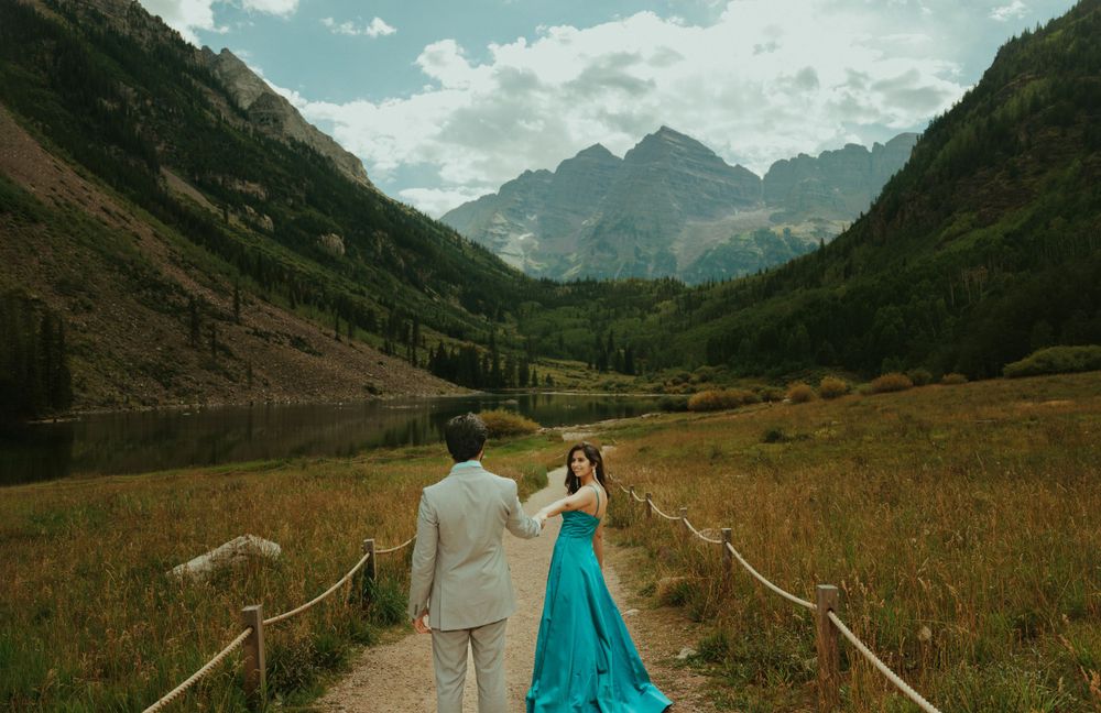 An intimate moment captured by a mountain lake with dramatic peaks and reflective waters.