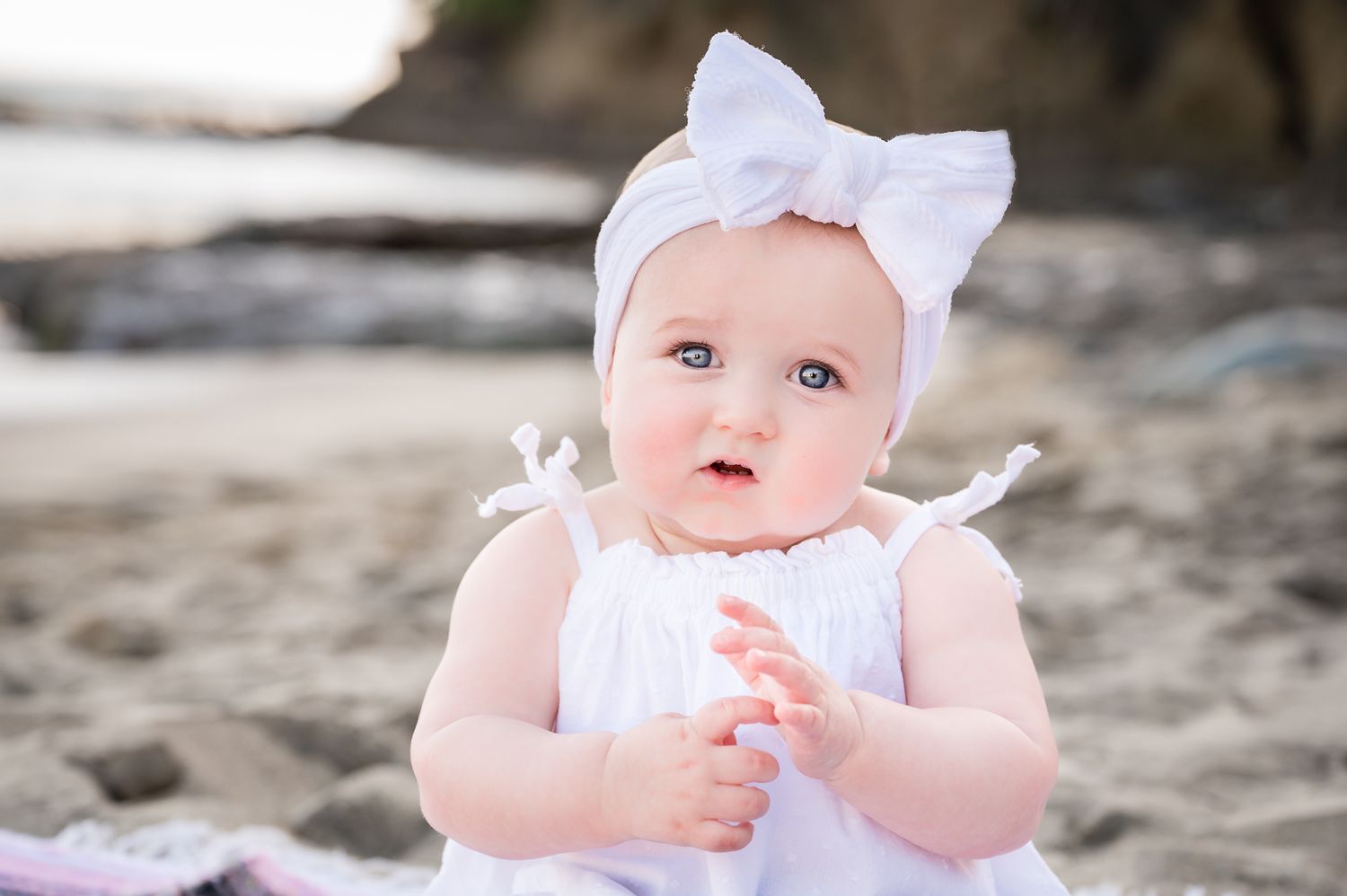 Image of a one year old baby girl on the beach in Laguna Beach, California