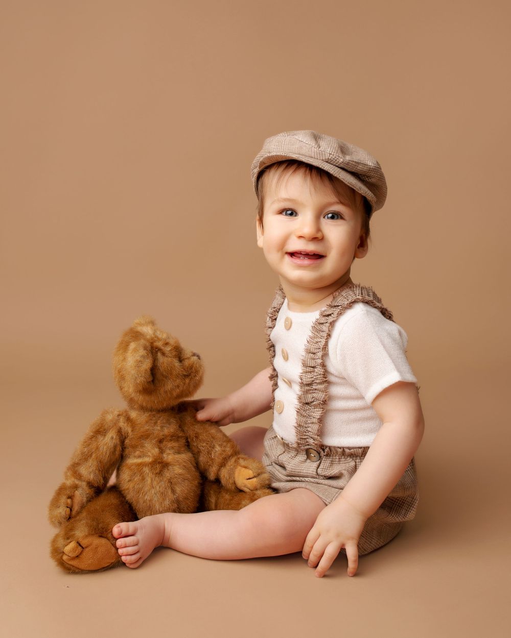 toddler photo boy sitting on the floor with a teddy bear portrait photo