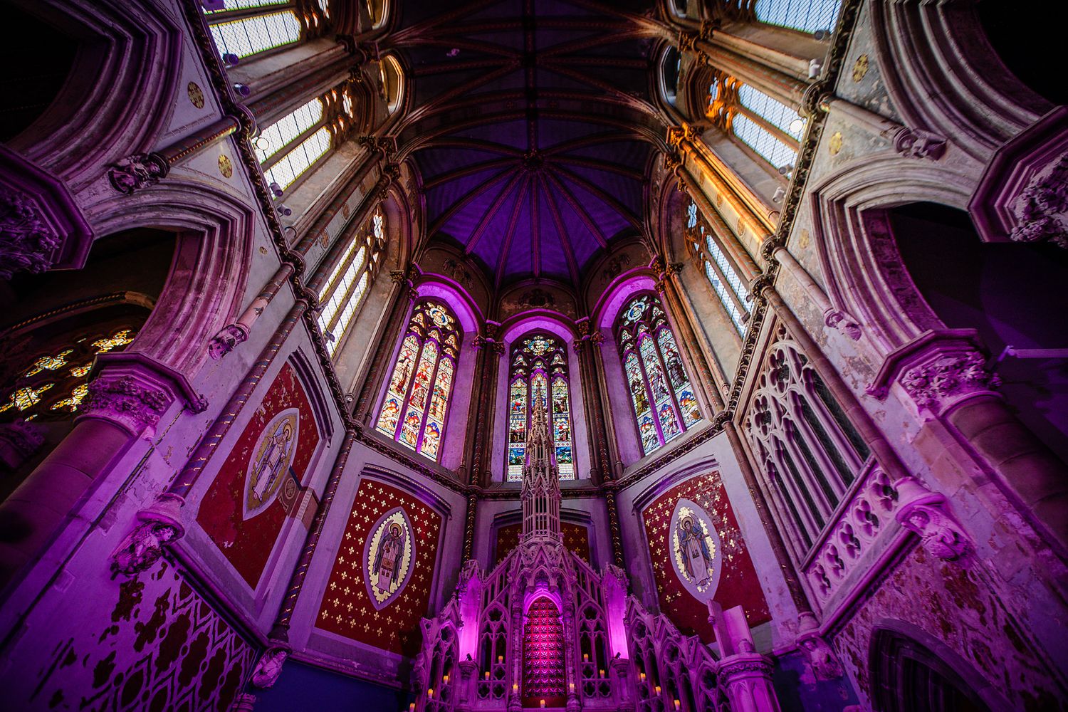Detailed architecture of the Gorton Monastery wedding ceremony room in Manchester showing huge stained windows