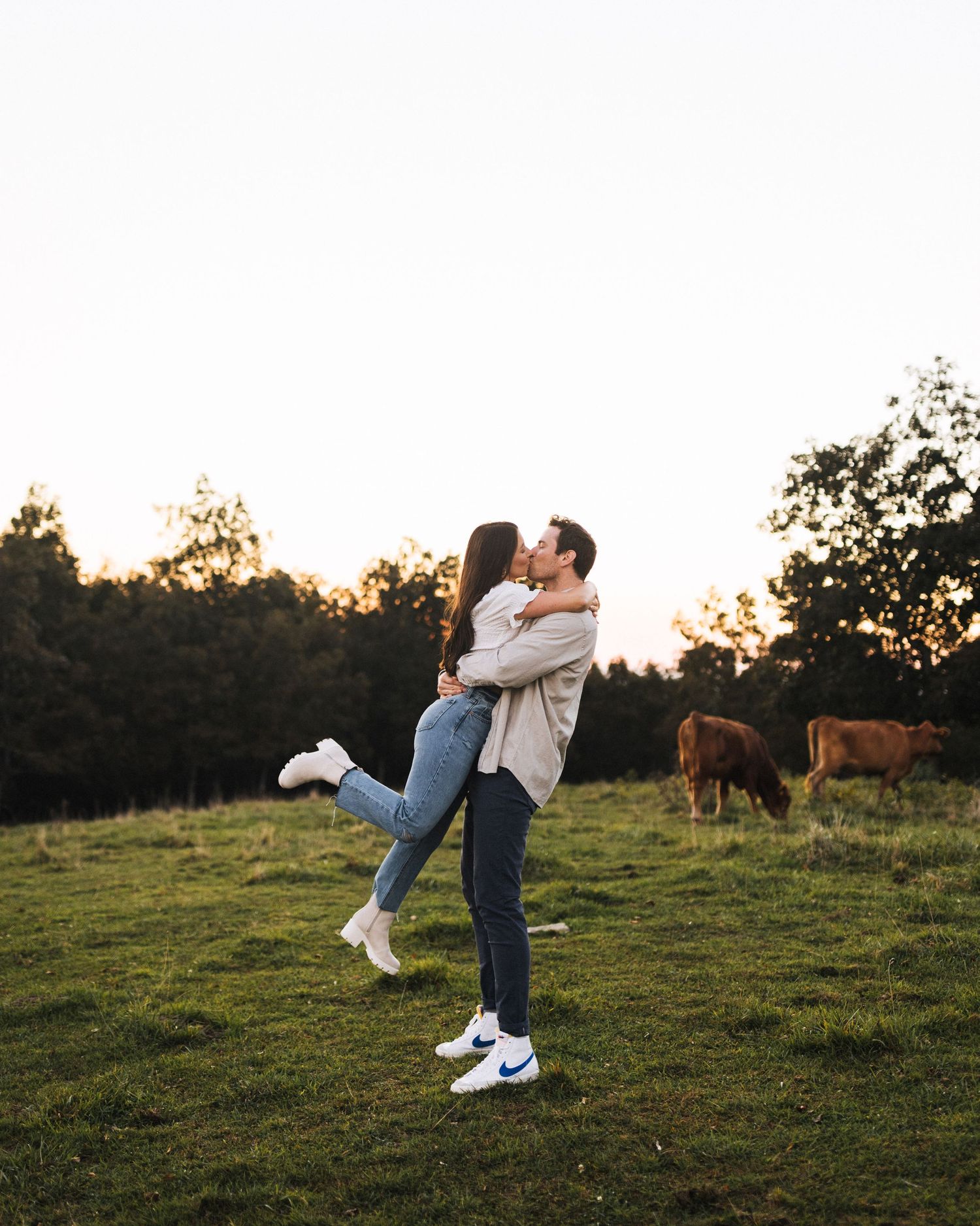 couple being photographed at bearwallow mountain trail for engagement photos